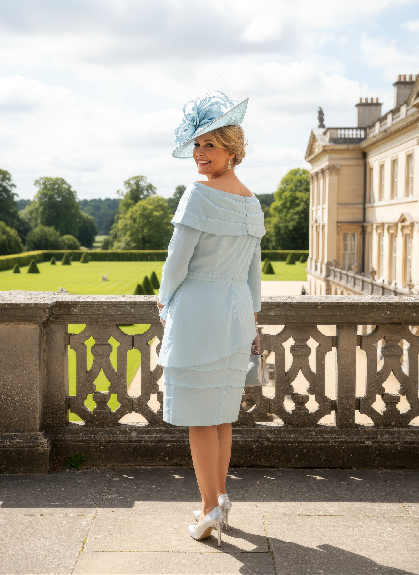 a woman wearing a mint mother of the bride dress from veromia - signature dress