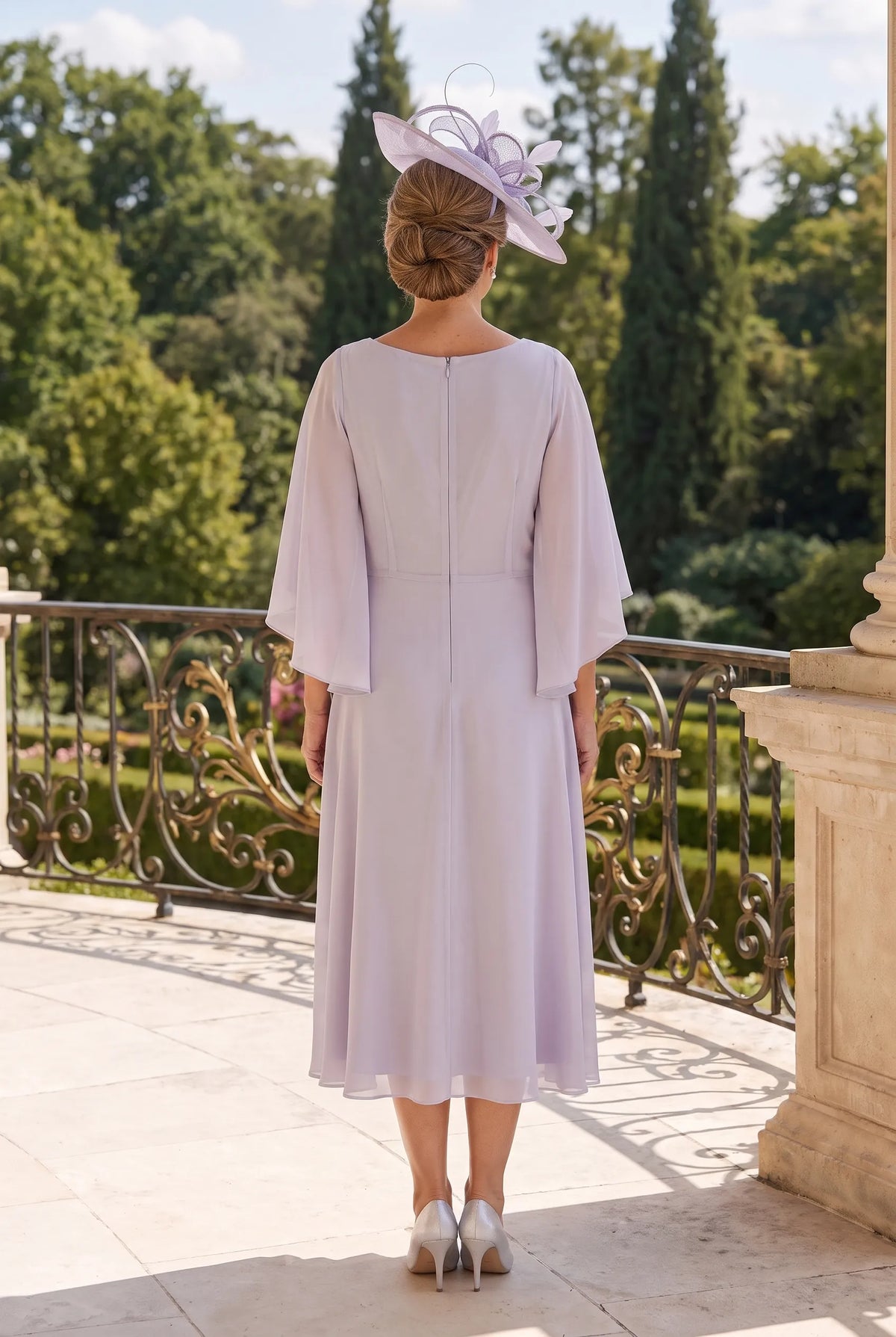 Back view of the dusty silver Lizabella 2646 Mother of the Bride dress with flowing chiffon cape sleeves