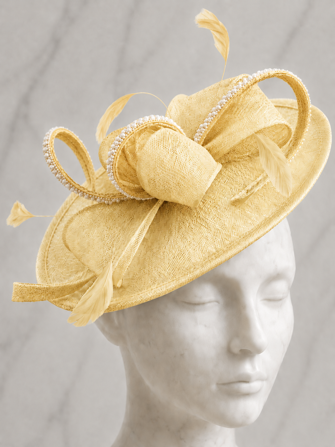 A Mother of the Bride lemon fascinator embellished hat with feathers, rhinestones and pearls
