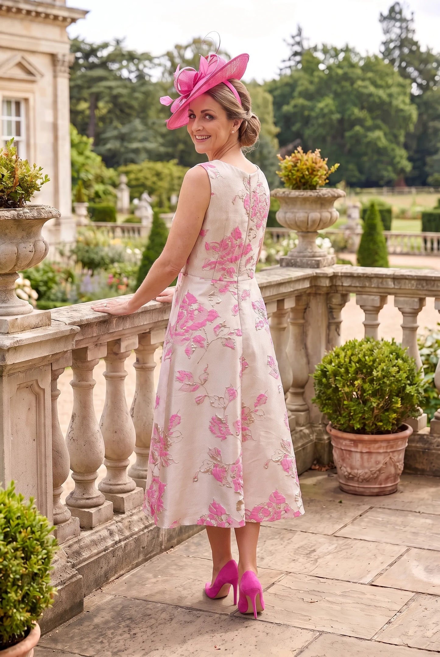 Rear view of the Pink Mother of the Bride Outfit by Lizabella 7224 showing the coordinating cropped jacket and elegant A-line silhouette.