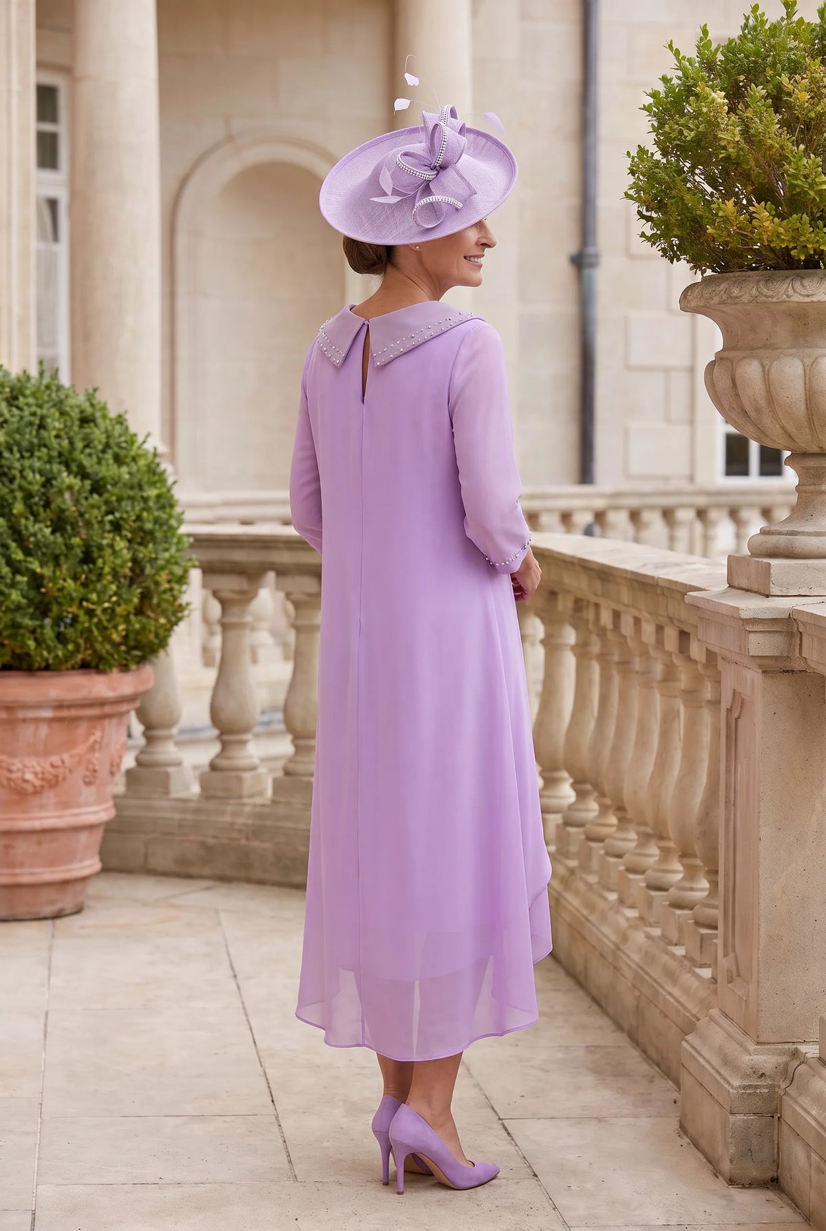 Back view of the Soft Lilac Lizabella 2979 Mother of the Bride dress with flowing chiffon overlay