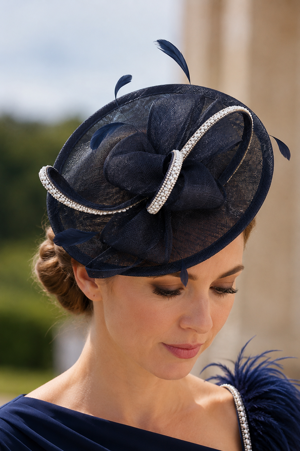 Navy fascinator for Mother of the Bride and wedding guest outfit with elegant feather and sinamay design