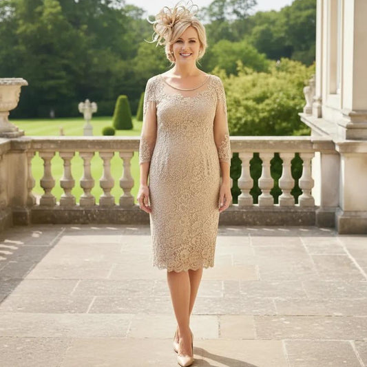 Woman in a condici beige mother of the dress and matching beige fascinator ready to attend a wedding. Signature Dress.