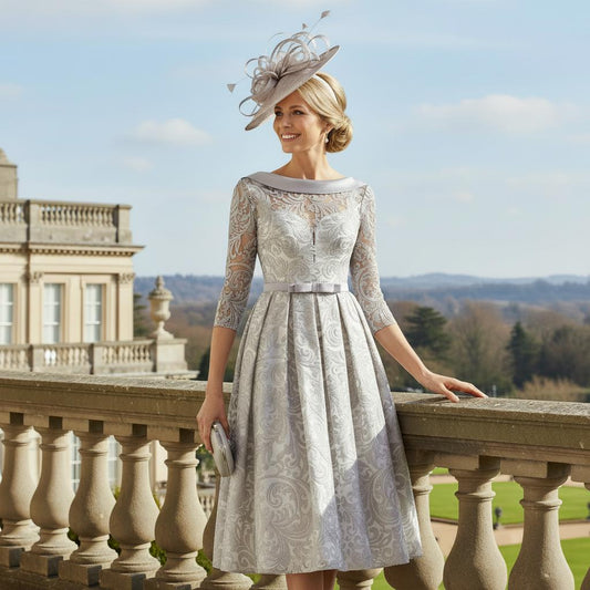 Woman wearing an A line Rosa Clara Couture Club Silver mother of the bride dress. Signature Dress.