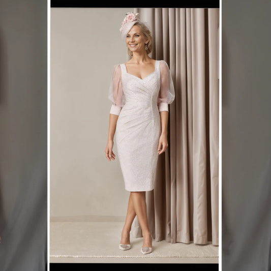 John Charles stretch jacquard combines with silk organza sleeves. The sweetheart neckline is finished with pearl detailing, perfect for the Mother of the Bride.