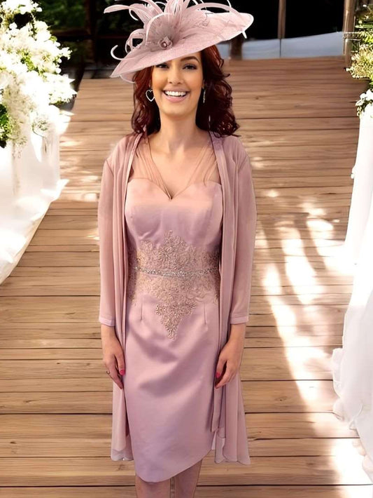 A satin pink shift dress featuring lace mesh on the shoulders and sleeves, intertwined with embellished details. It also boasts embellishment at the centre waist and comes with a lightweight chiffon jacket.