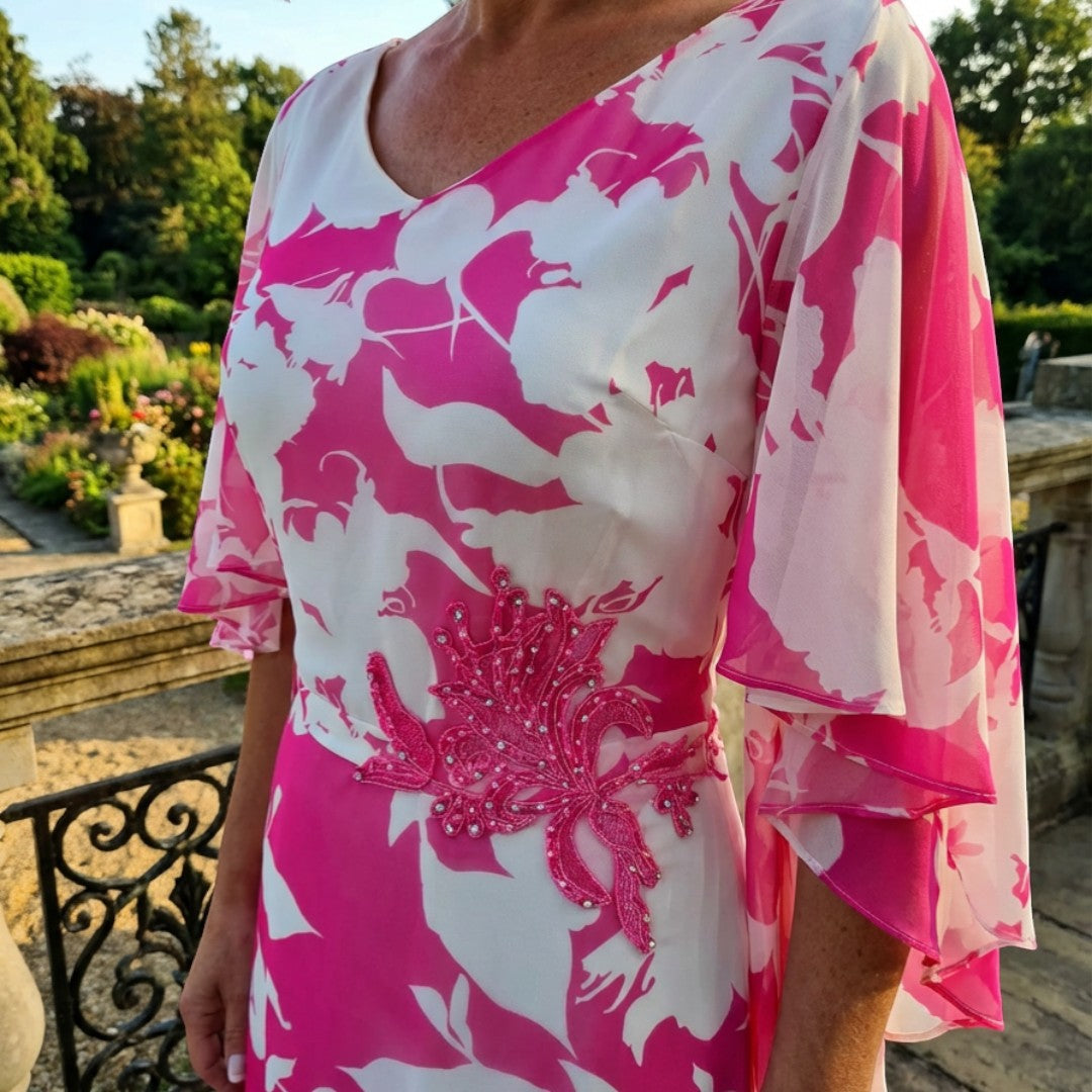 Close‑up of the embellished waist on the Lizabella 2664 hot pink chiffon mother of the bride dress, showing beadwork and flattering detailing.