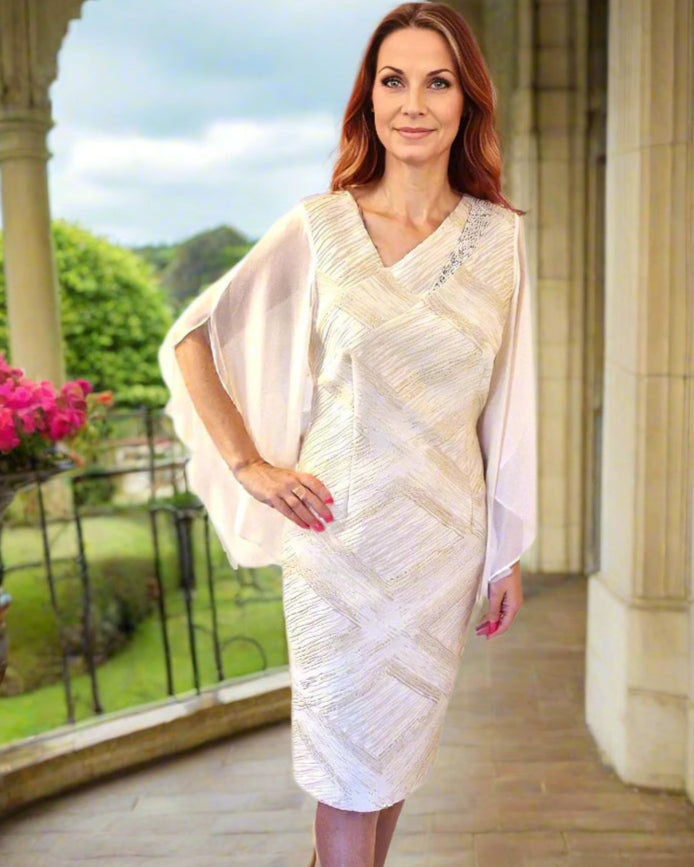 Elegant Mother of the Bride Dress with fitted silhouette in jacquard with subtle metallic thread, floaty chiffon sleeves with asymmetric V neck.