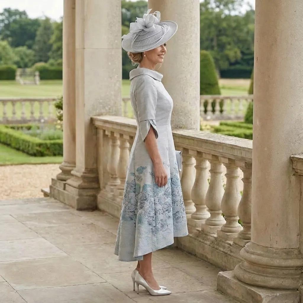 Woman in a Lizabella Silver mother of the bride dress, the dress is high low with 3/4 sleeves. Signature Dress.