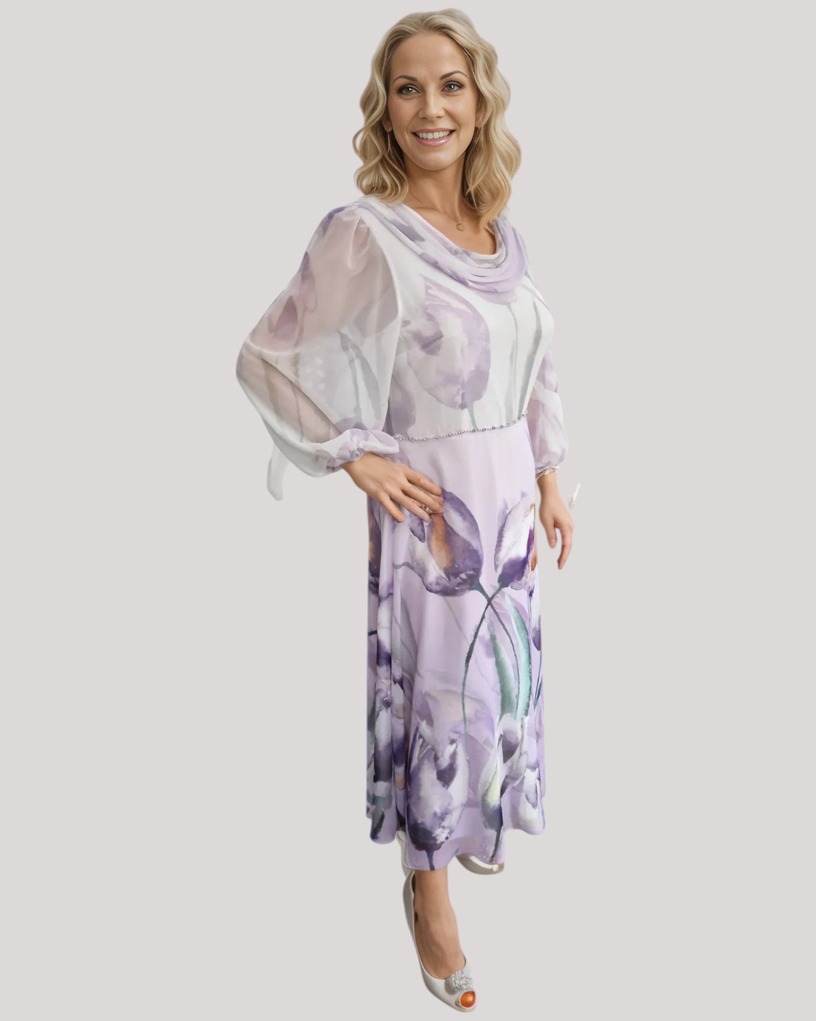 A beautiful dress in purple floral chiffon fabric.  The A line dress has a draped neckline with full 3/4 sleeves. a perfect dress for the mother of the bride.