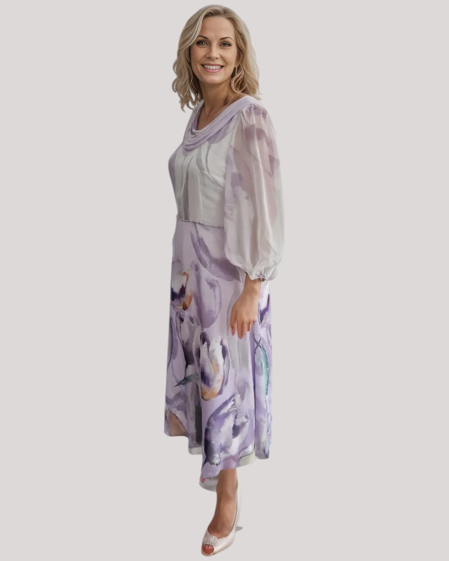 A beautiful dress in purple floral chiffon fabric.  The A line dress has a draped neckline with full 3/4 sleeves. a perfect dress for the mother of the bride.