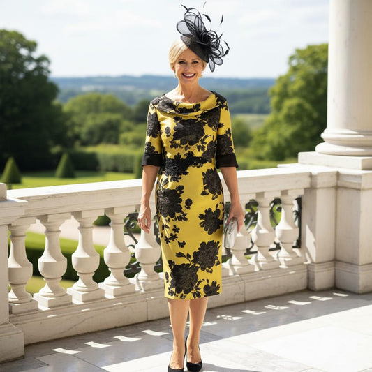 Woman in a yellow and black mother of the bride dress. signature dress