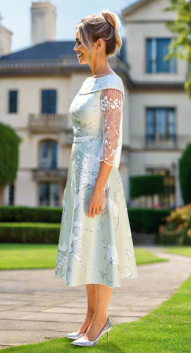 Woman wearing a light green lace dress 