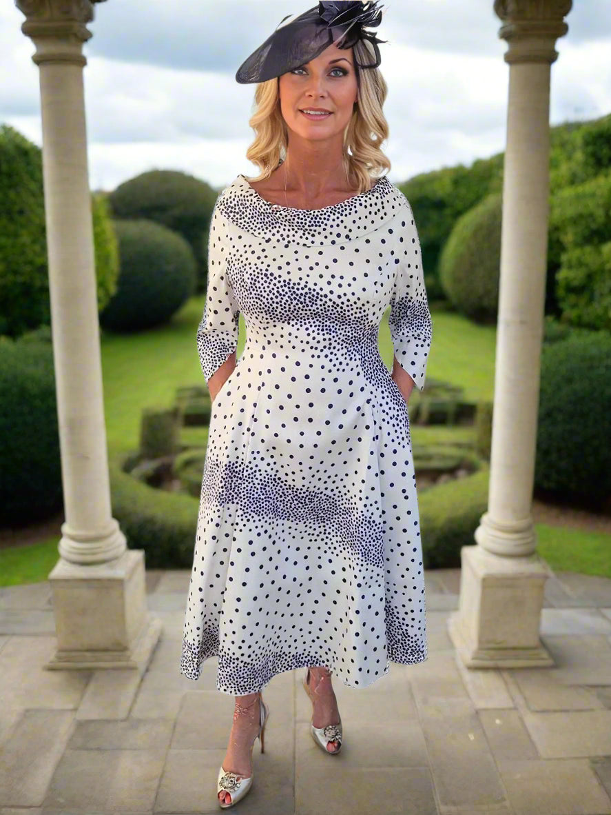 Lizabella Dress Lovely polkadot print Aline dress with elbow length sleeves. The Aline skirt skims gently over the hips creating a super flattering shape.