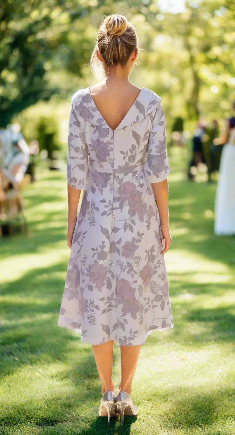 Woman wearing a floral dress at a wedding