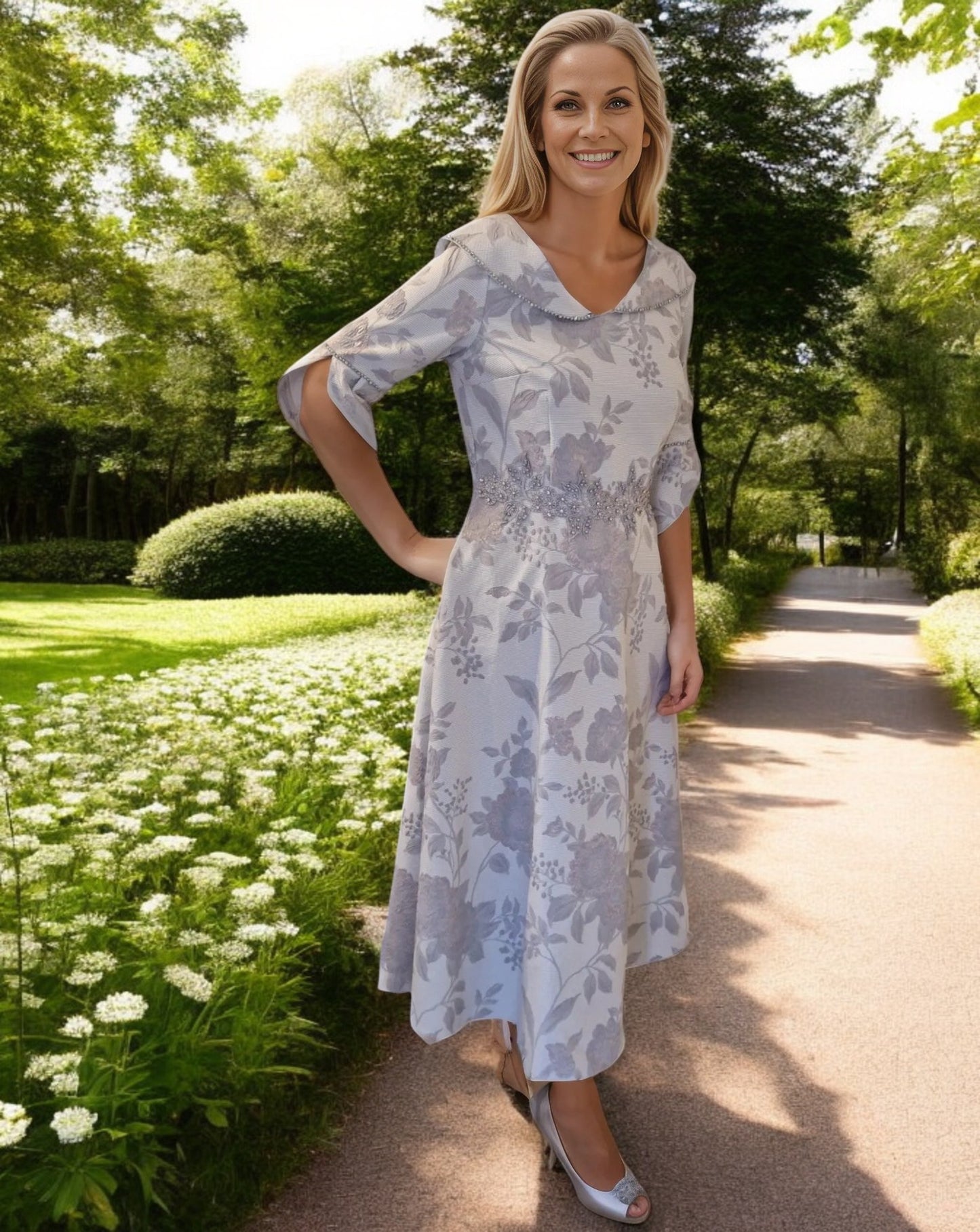 A jacquard and floral print A line Dress with a beautiful V neck line collar detail.

Bell cuff sleeves that finish at the elbow with sparkling detailing on the cuffs and to the collar and slip side pockets.