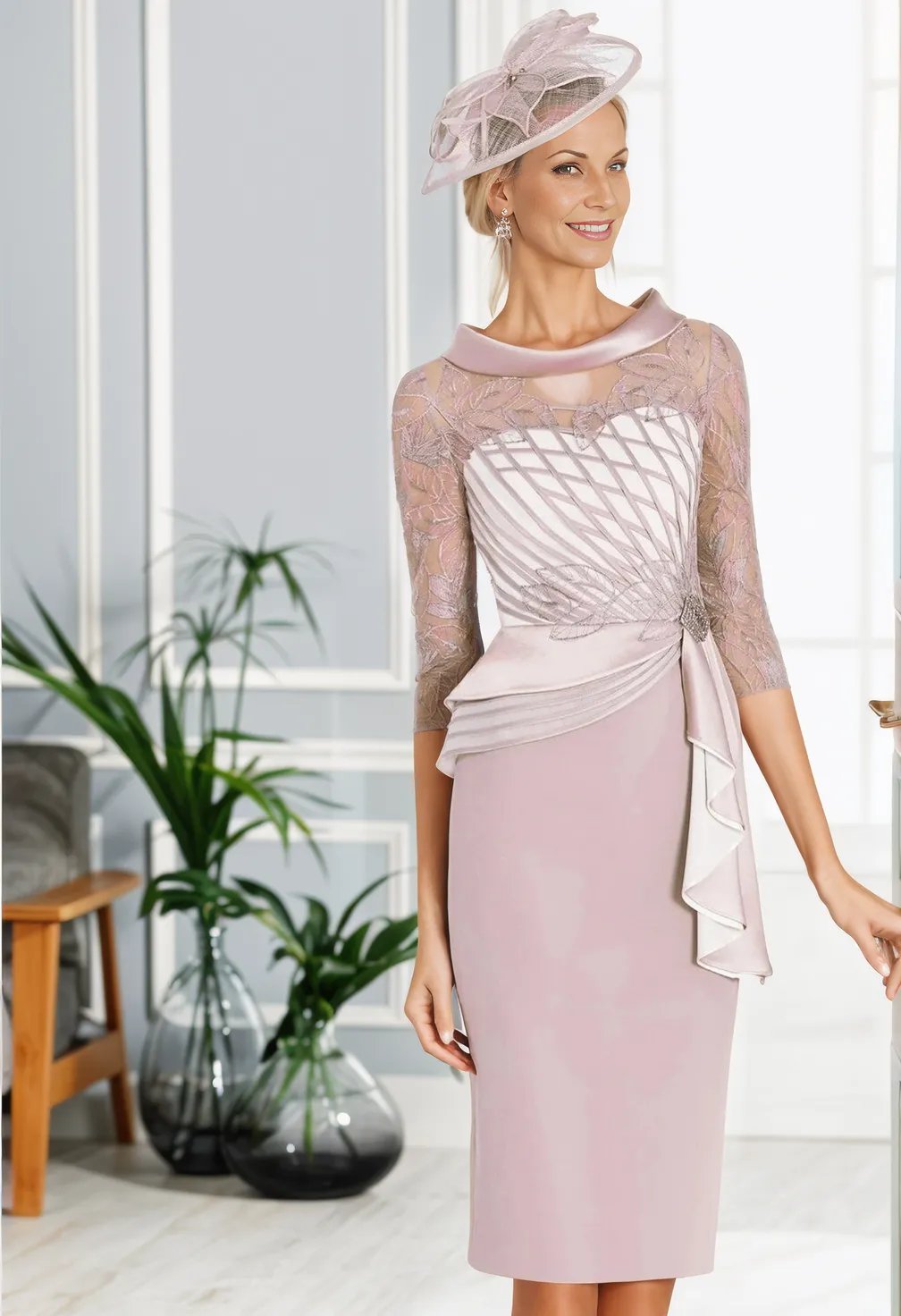 Fashionable mother of the bride/groom outfits from Rosa Clara's Couture Club collection. Features a concealed zip, side broach, and long-sleeved lace material.