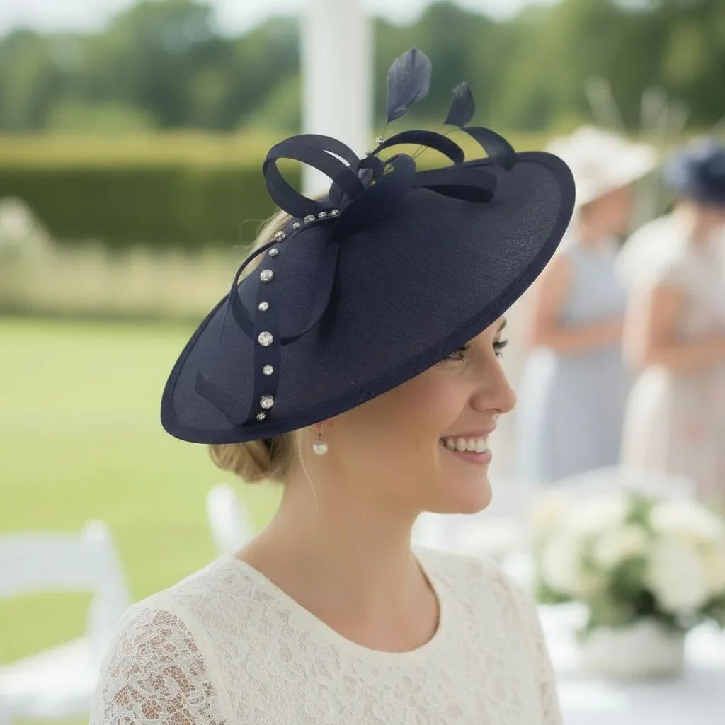 Woman wearing a navy blue hat with decorative elements in an outdoor setting