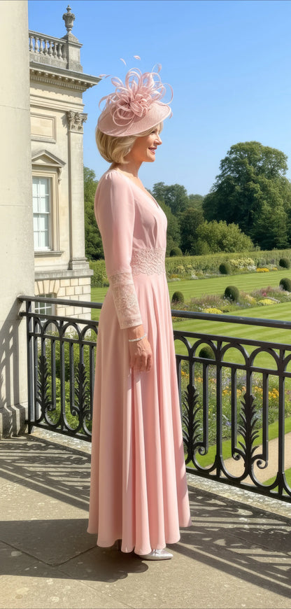 Woman in a pink veni infantino dress with a matching fascinator 