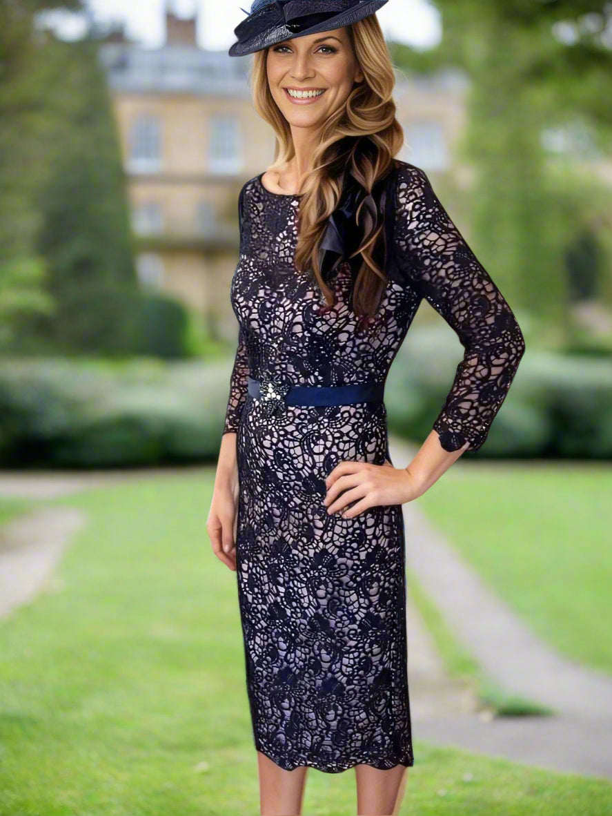 Navy lace dress with 3/4 sleeves, zip closure, and fully lined with embellished centre waist beadwork Ideal for weddings / special occasions. Timeless and chic.