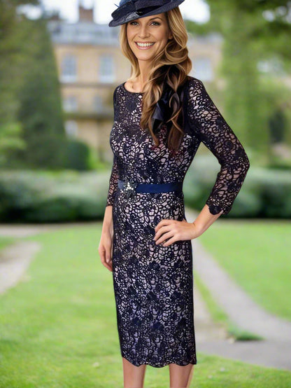 Navy lace dress with 3/4 sleeves, zip closure, and fully lined with embellished centre waist beadwork Ideal for weddings / special occasions. Timeless and chic.