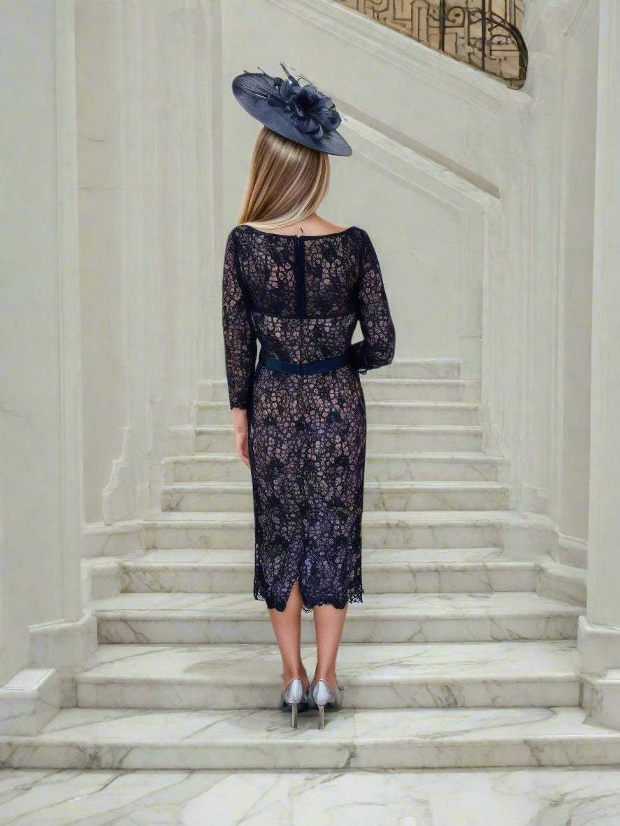 Navy lace dress with 3/4 sleeves, zip closure, and fully lined with embellished centre waist beadwork Ideal for weddings / special occasions. Timeless and chic.