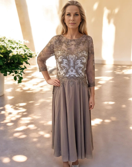 Chiffon a line dress with illusion sweetheart neckline and 3/4 sleeves.

This elegant embroidered dress is perfect for any mother of the bride or groom.