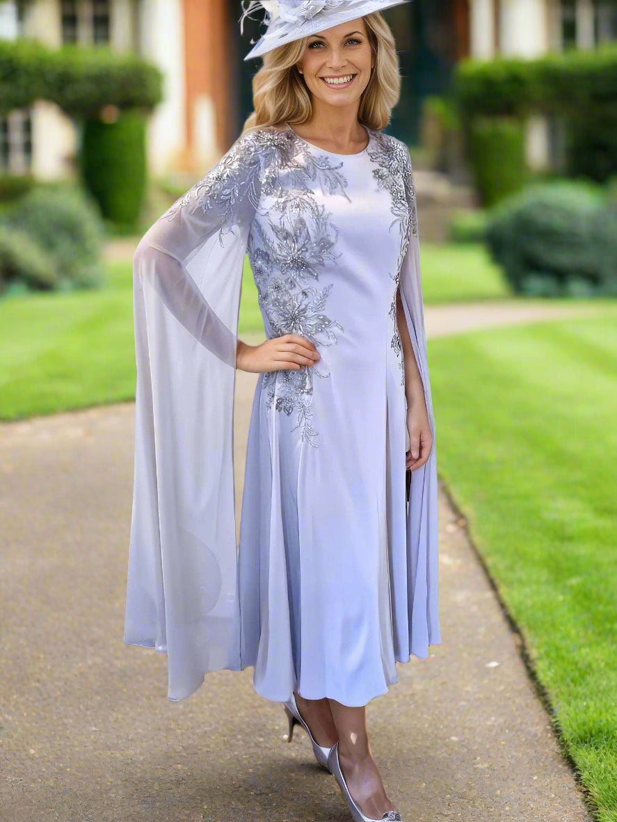 Veni Infantino dress in silver with long cape sleeves a perfect dress for the mother of the bride or mother of the groom or event to wear at ascot races!. 