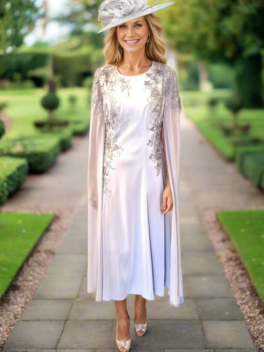 Veni Infantino dress in silver with long cape sleeves a perfect dress for the mother of the bride or mother of the groom or event to wear at ascot races!. 