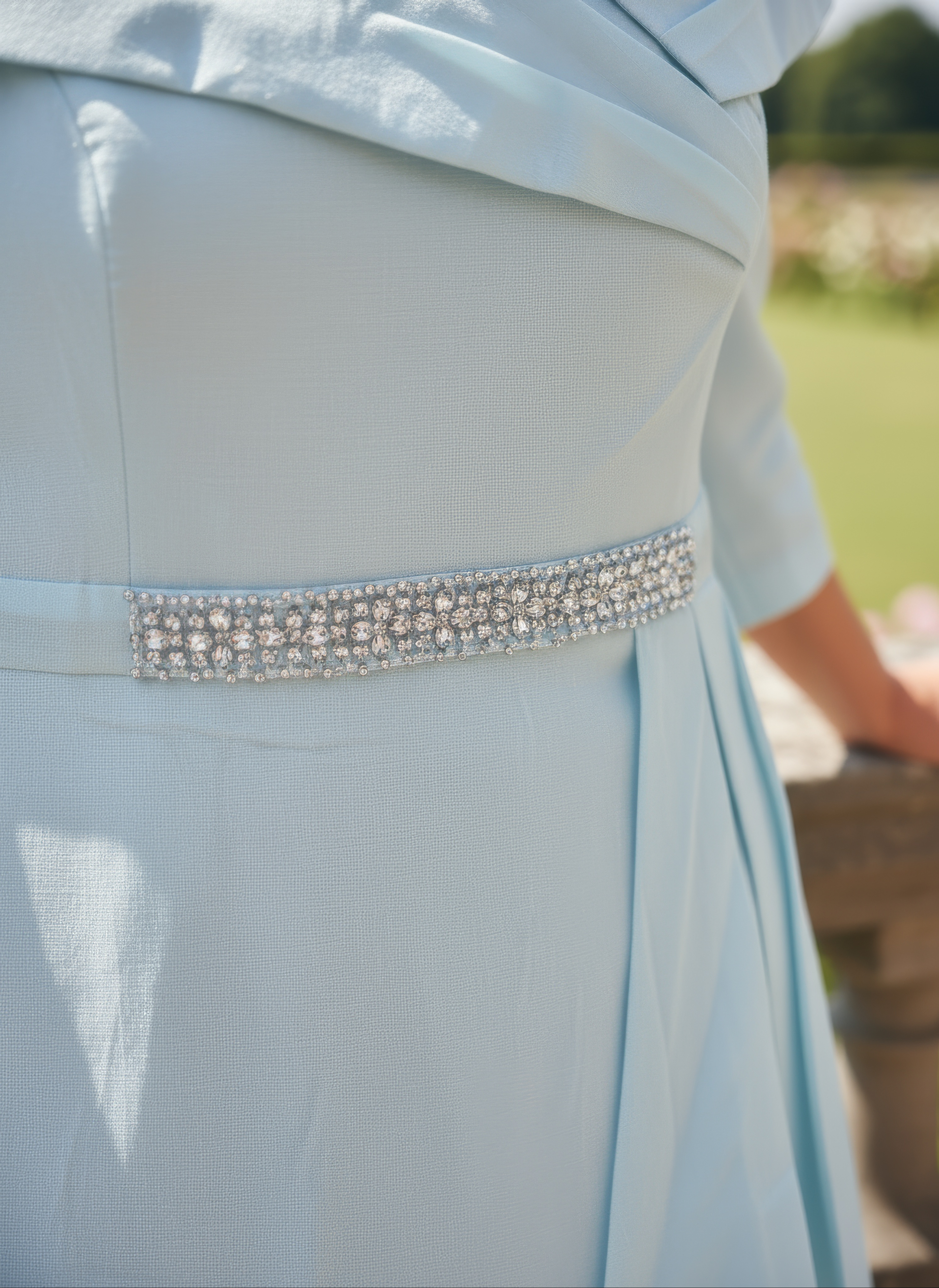 a woman wearing a mint mother of the bride dress from veromia - signature dress