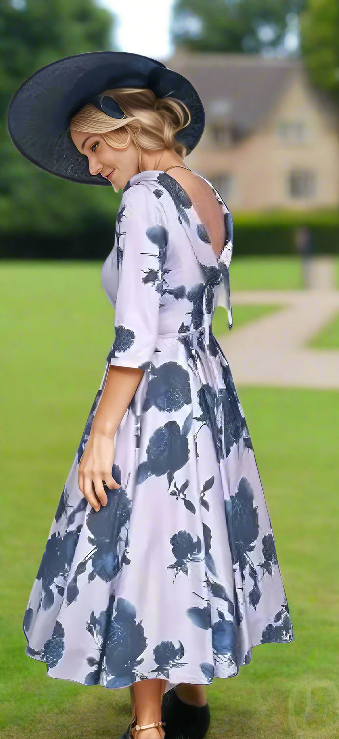 Fit and Flare Floral Dress from Veromia Occasions. full skirt, a bateau neck, V at the back, 3/4 sleeves, a midi length and diamante trim to the waist.