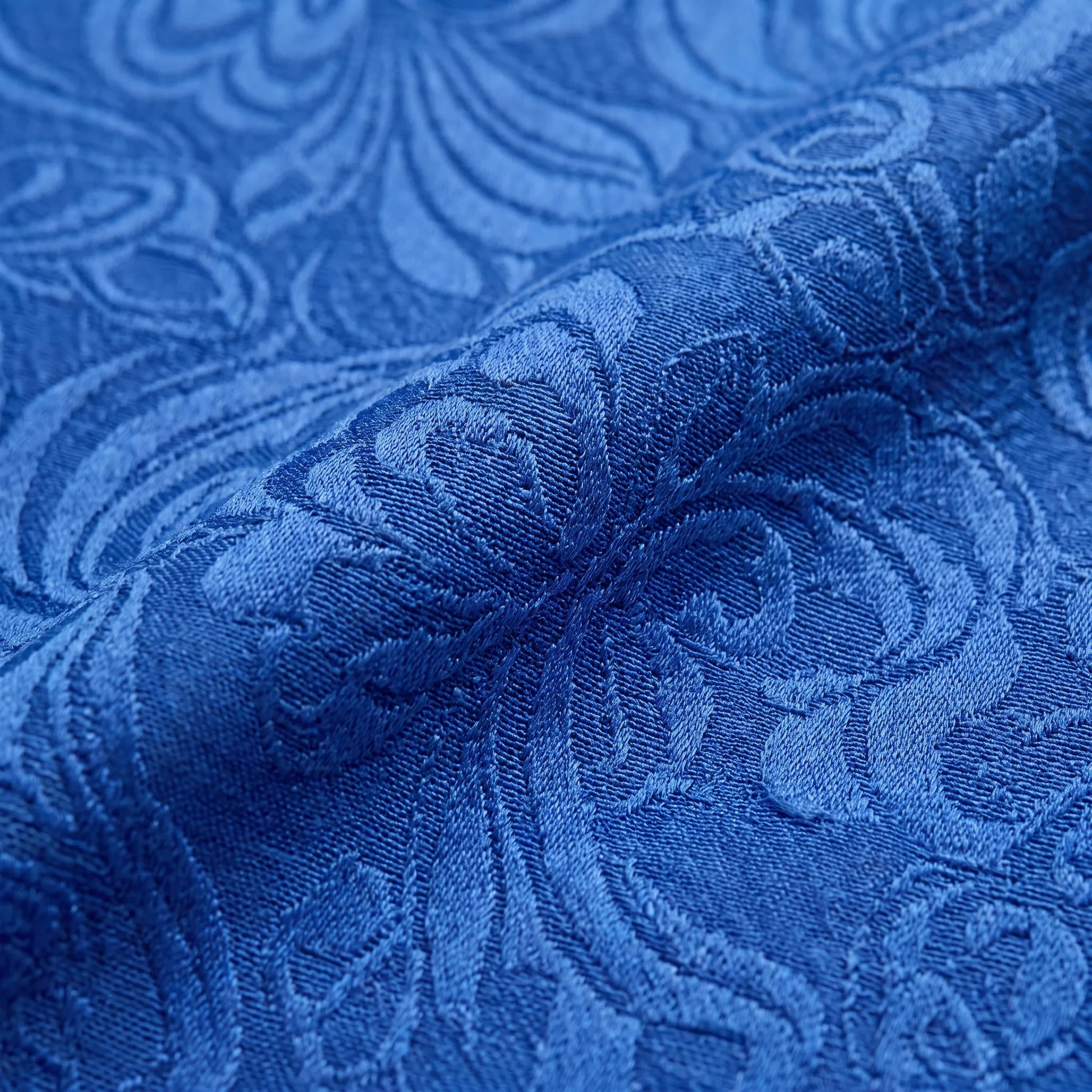 Close-up of the Couture Club 3G2B0 blue jacquard fabric showing the elegant woven texture.