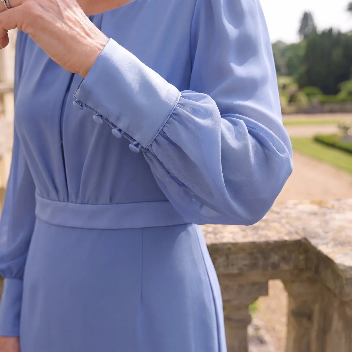 Close-up of the long chiffon sleeve and cuff detail on the Blue Richard Designs RDAD1139 dress