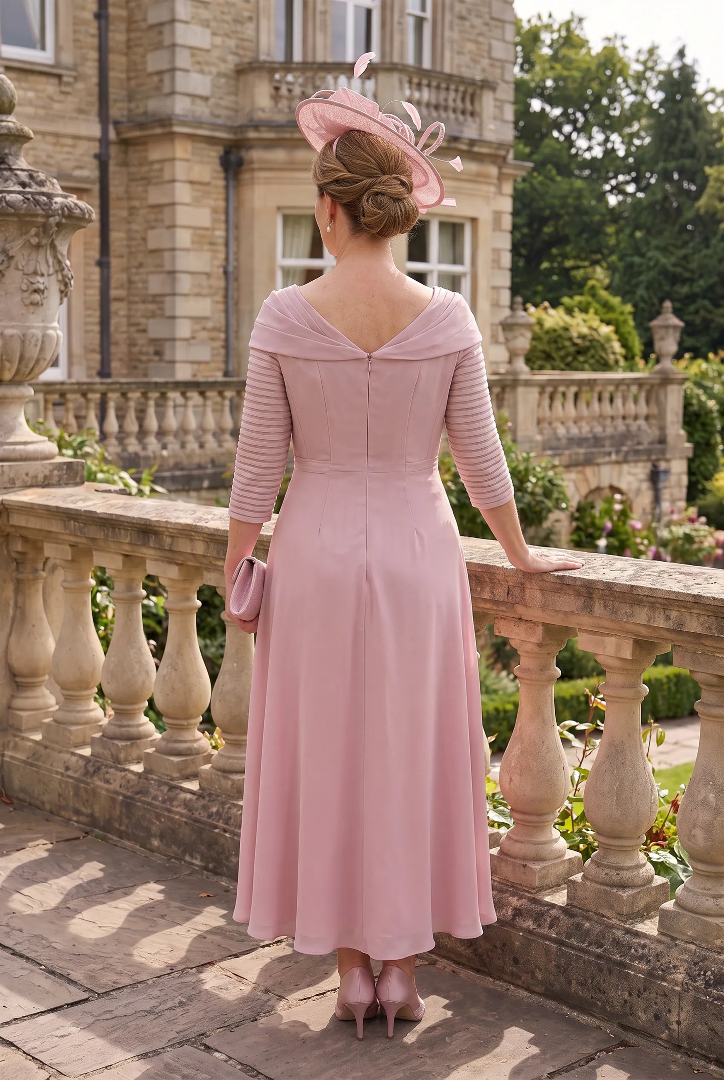 Rear view of the Blush Pink Mother of the Bride Dress by Couture Club 5G114 showing the elegant chiffon skirt and flattering silhouette.
