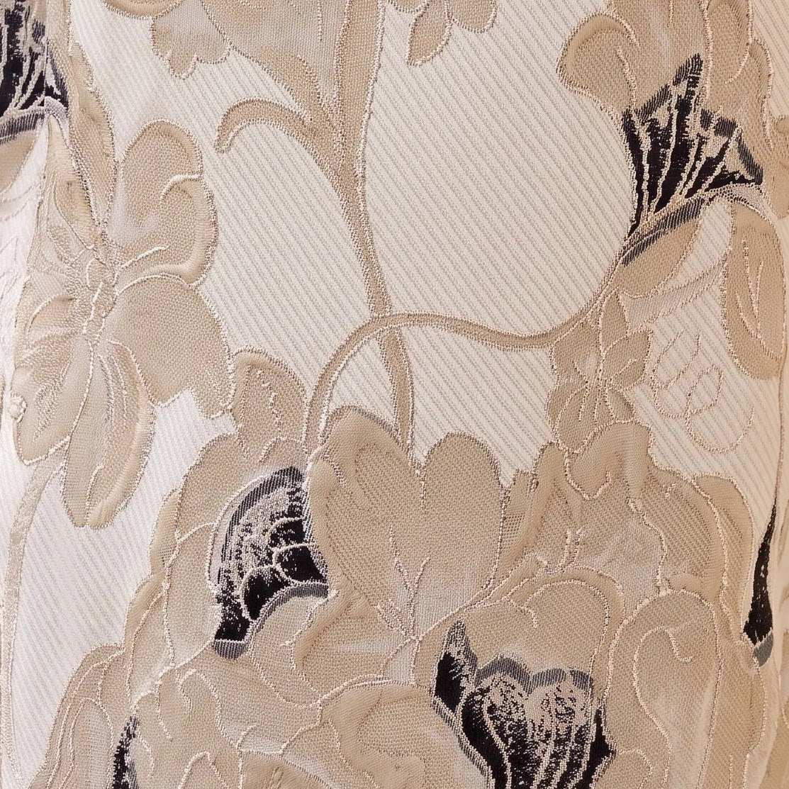 Close-up of the Fely Campo 21332 floral jacquard fabric featuring champagne gold, ivory, taupe and black floral detailing.