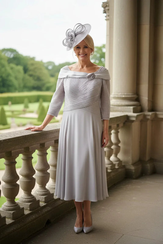 Couture Club 5G114 silver Mother of the Bride dress with pleated bardot bodice, floral applique, chiffon skirt and three-quarter sleeves.