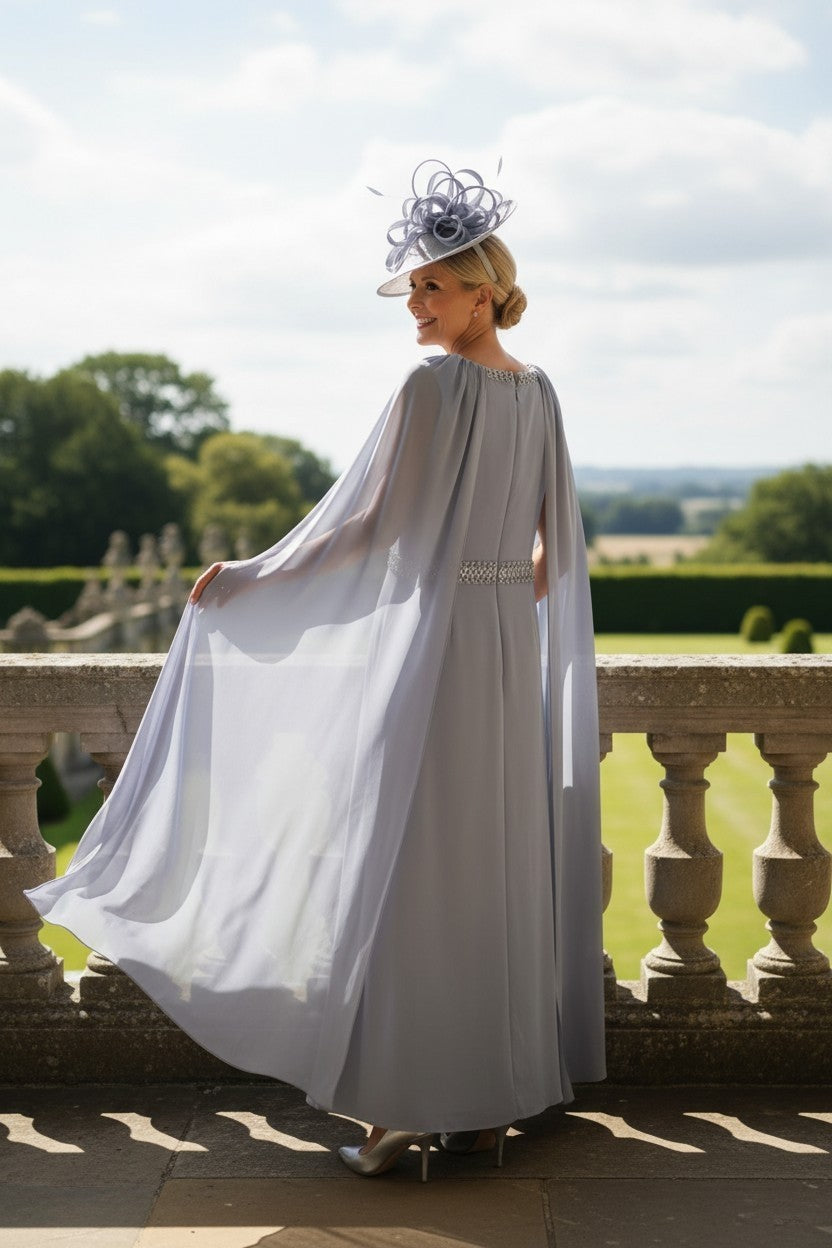 Rosa Clara Couture Club 8G151 blueâ€‘grey mother of the bride dress with flowing chiffon cape sleeves and embellished waistband, showing the back of the dress
