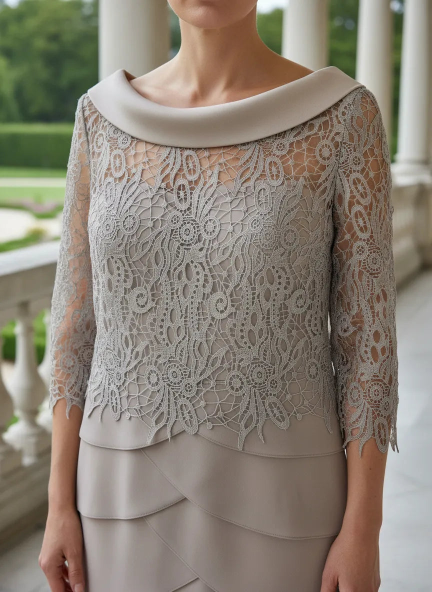 Woman wearing a beige lace mother of the bride dress outdoors.
