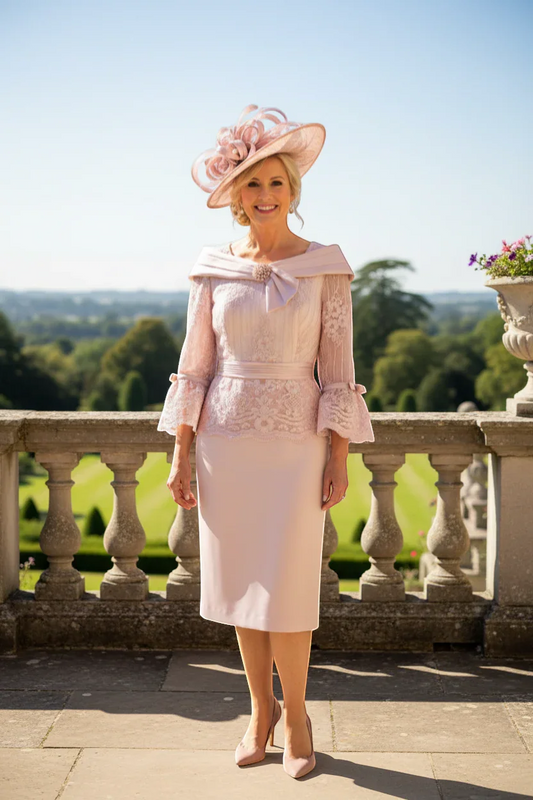 couture club dusty pink lace and sequin dress with peplum waist, fluted sleeves, and bow detail. Ideal for mother of the bride.