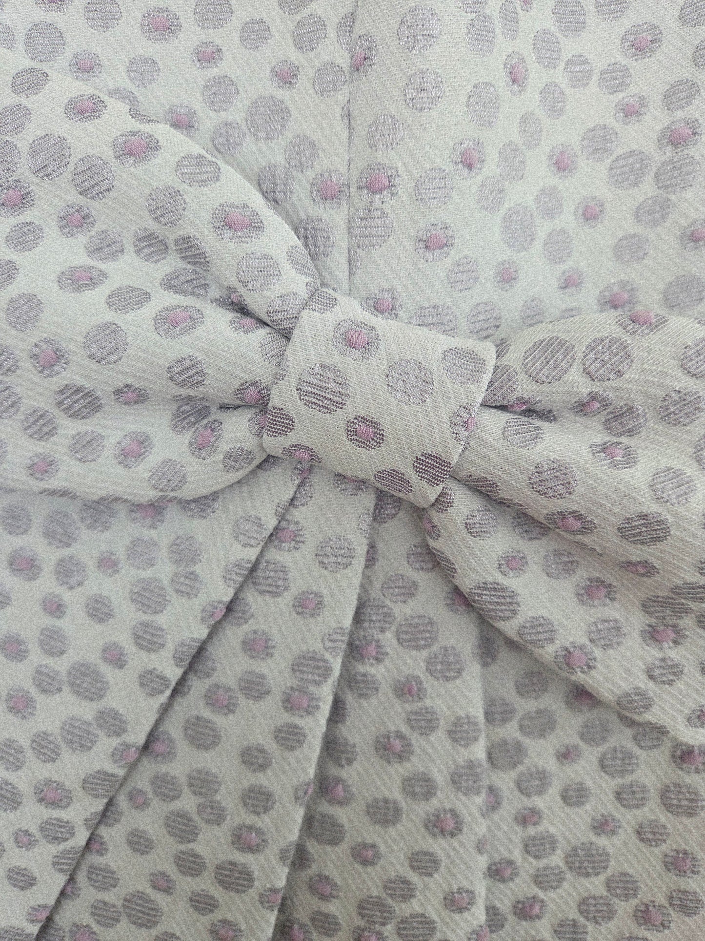 a zoomed in image of the fabric for a lilac dress
