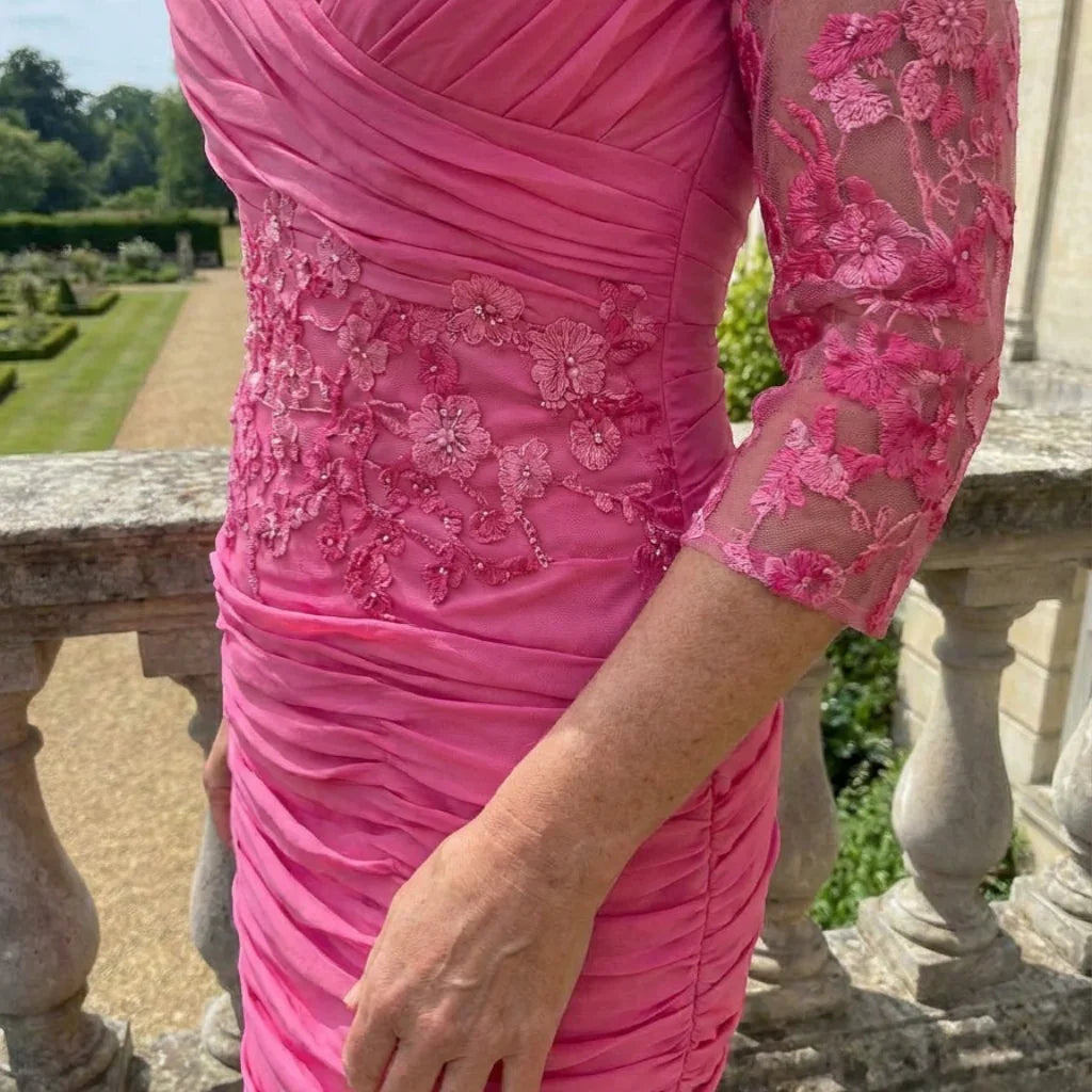 Close‑up of the Ispirato ISJ823 pink dress showing ruching, floral lace sleeves and waist embellishment.