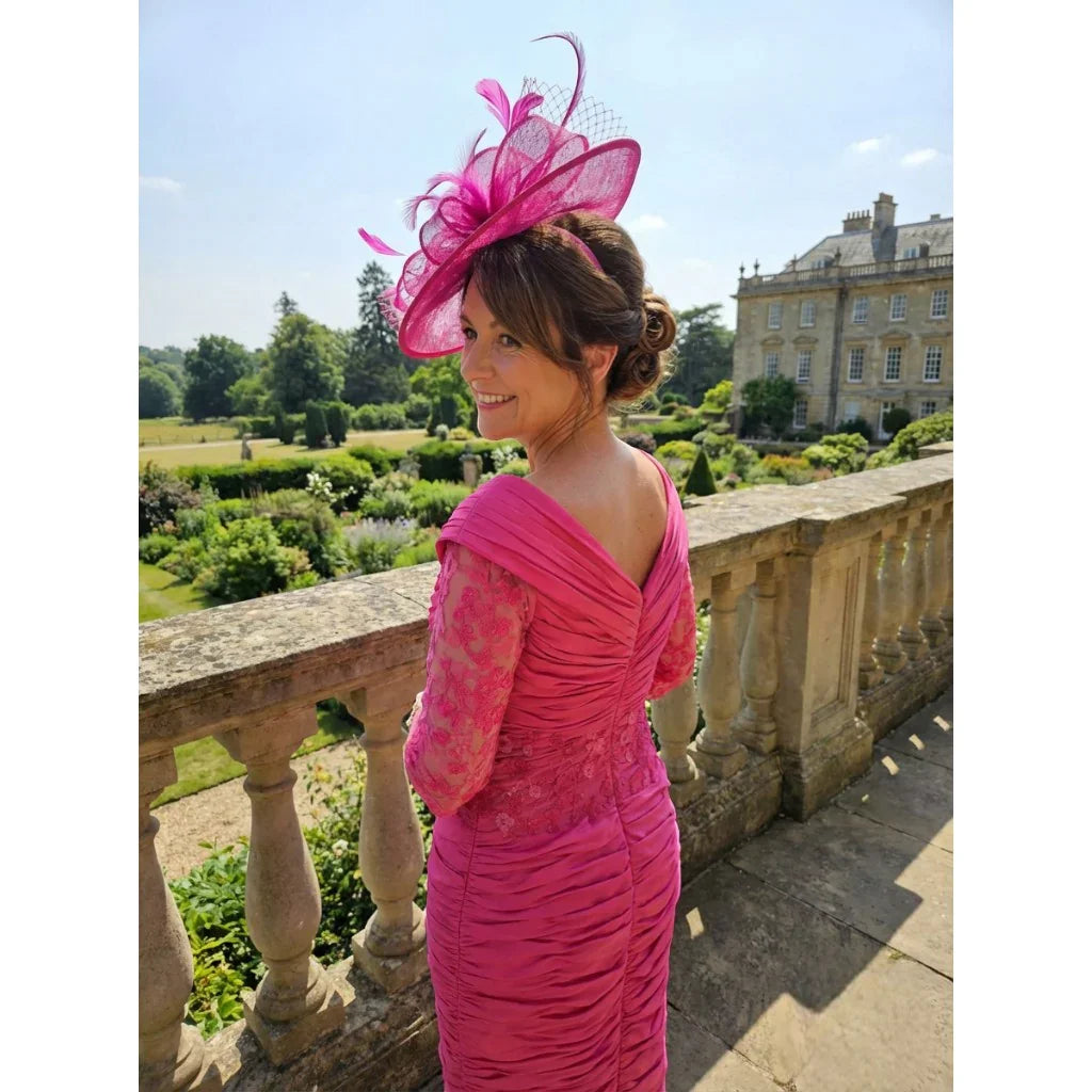 back view of the Ispirato ISJ823 pink mother of the bride dress with ruched detailing and embellished sleeves.