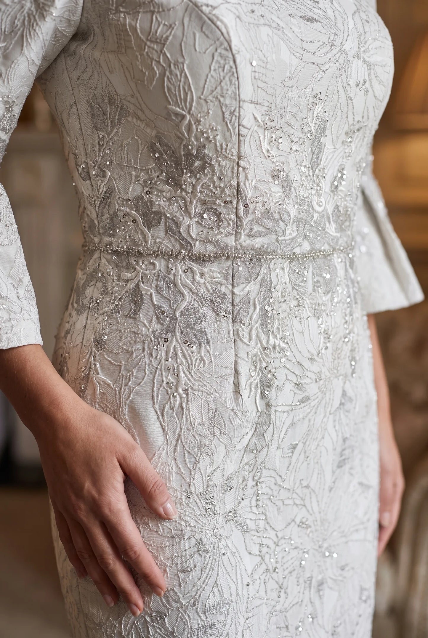 Close-up of the embroidered floral bodice and beaded waistband on the John Charles 26713 dress