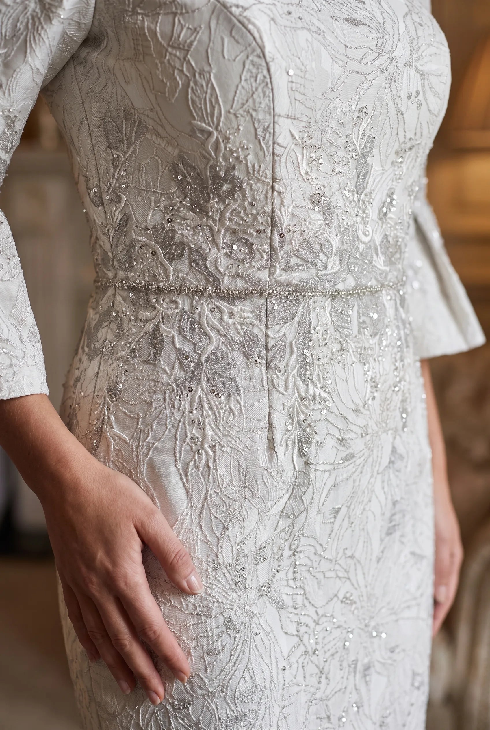 Close-up of the embroidered floral bodice and beaded waistband on the John Charles 26713 dress