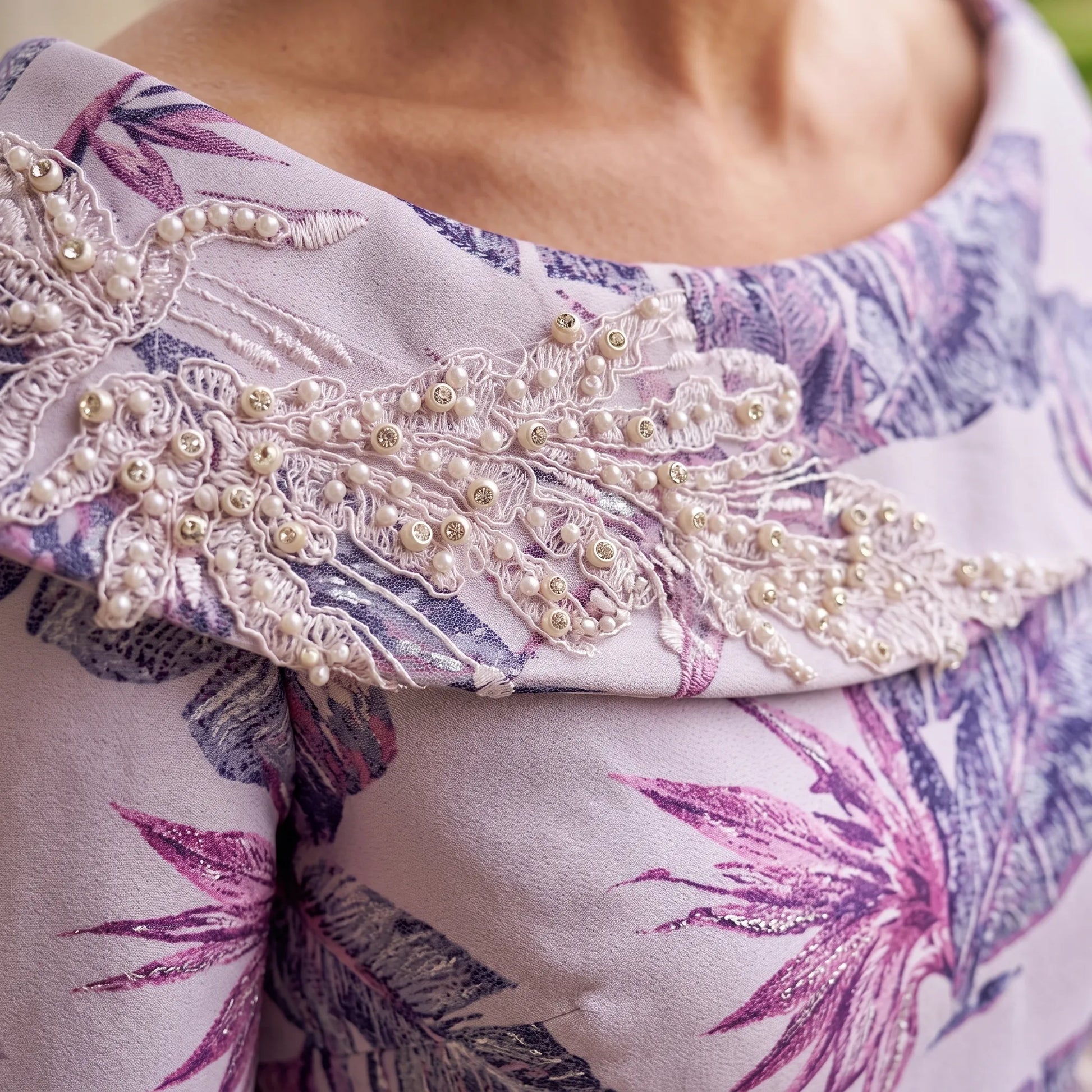 Close-up of the pearl embroidered boat neckline on the Lilac Mother of the Bride Dress by Lizabella.