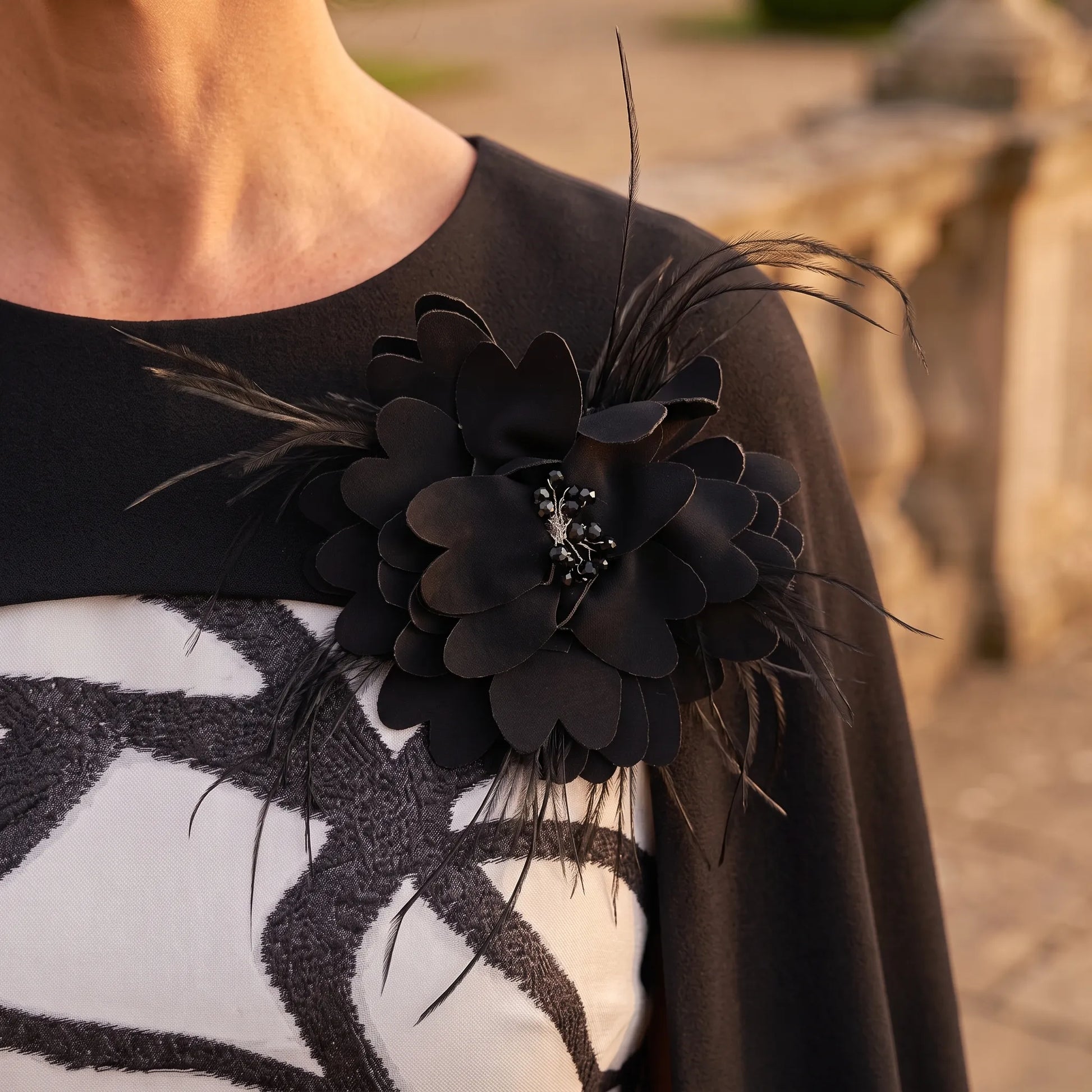 Close-up of the black and ivory floral fabric on the Lizabella 2266 mother of the bride dress.