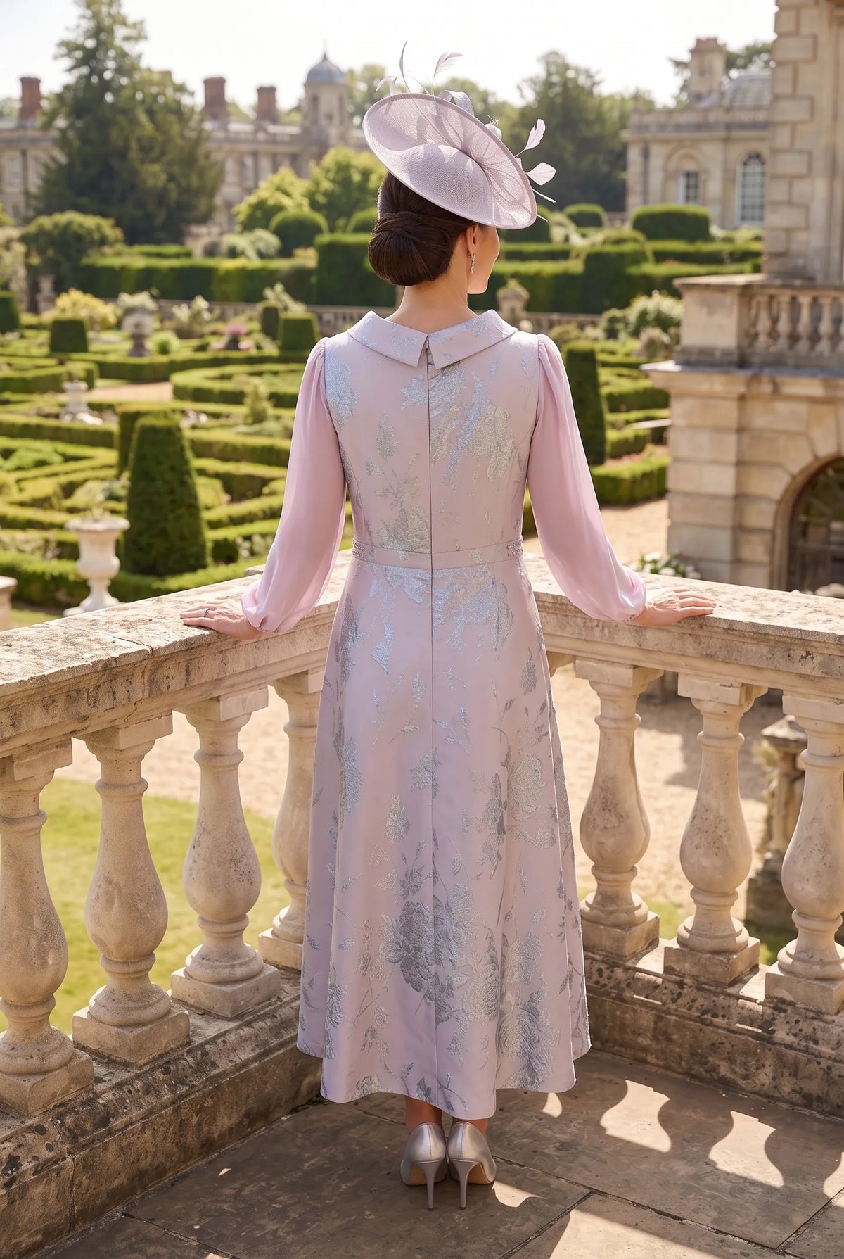 Back view of the Lizabella 2809 lilac mother of the bride dress with flowing sleeves and elegant A-line silhouette.
