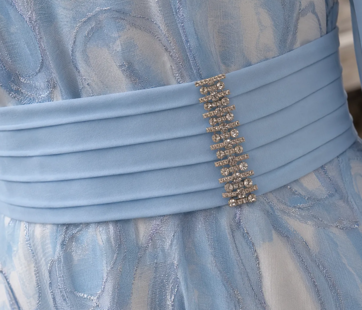 Close-up of pleated waistband and sparkling embellishment on Lizabella 2834 light blue dress