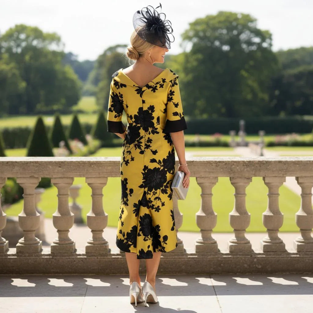 back view of a Lizabella 2950 mustard Mother of the Bride dress with tailored fit and elegant embellished detailing.