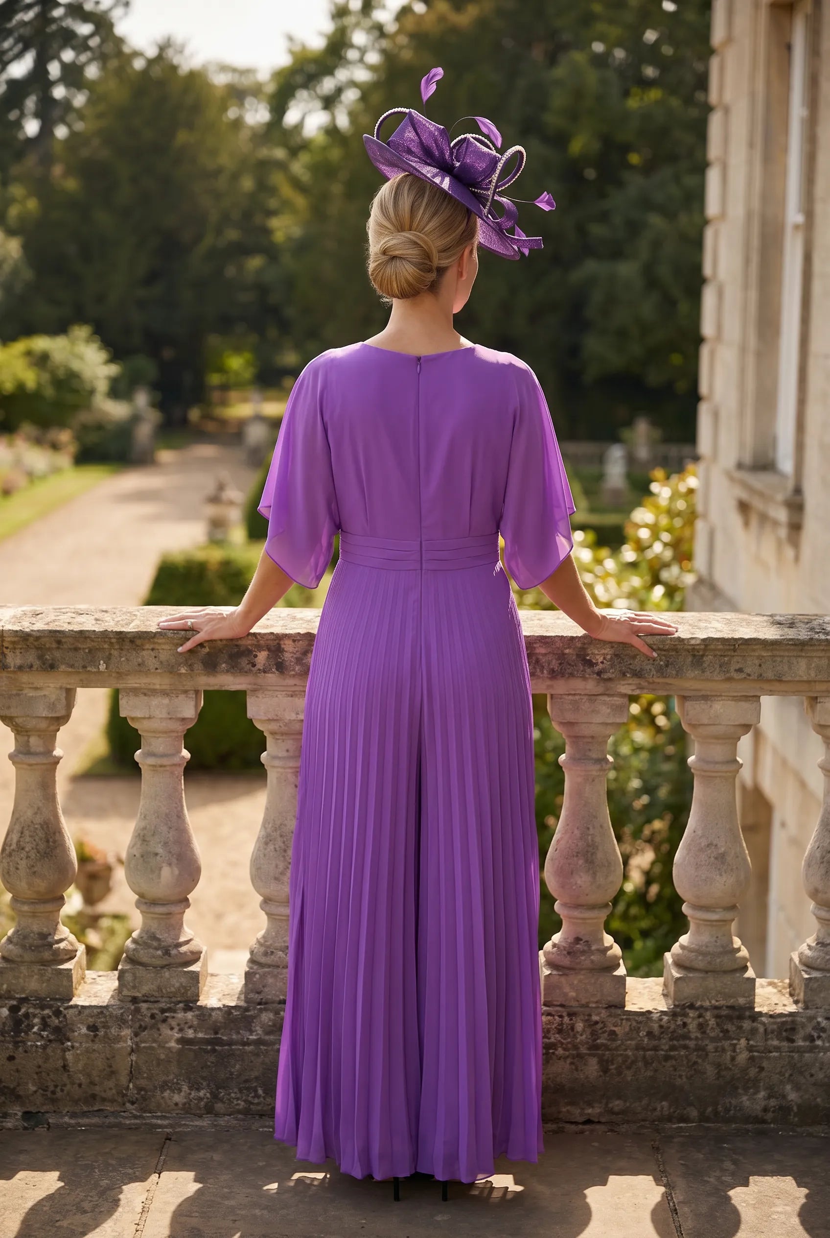 Back view of Lilac Mother of the Bride jumpsuit by Lizabella 5081 with pleated wide-leg design